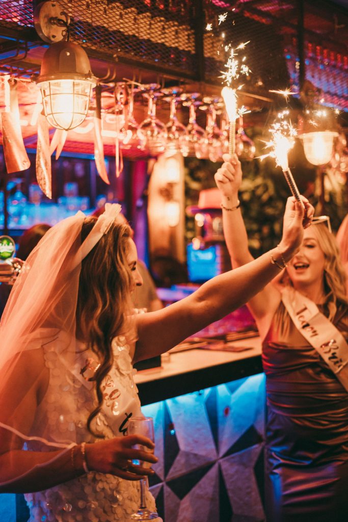 Bride-to-be with sparklers at the bar